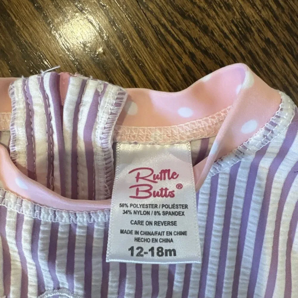 EUC Girls RuffleButts Bathing‎ Suit Purple Stripe With Pink Bow Sz 12-18 Months